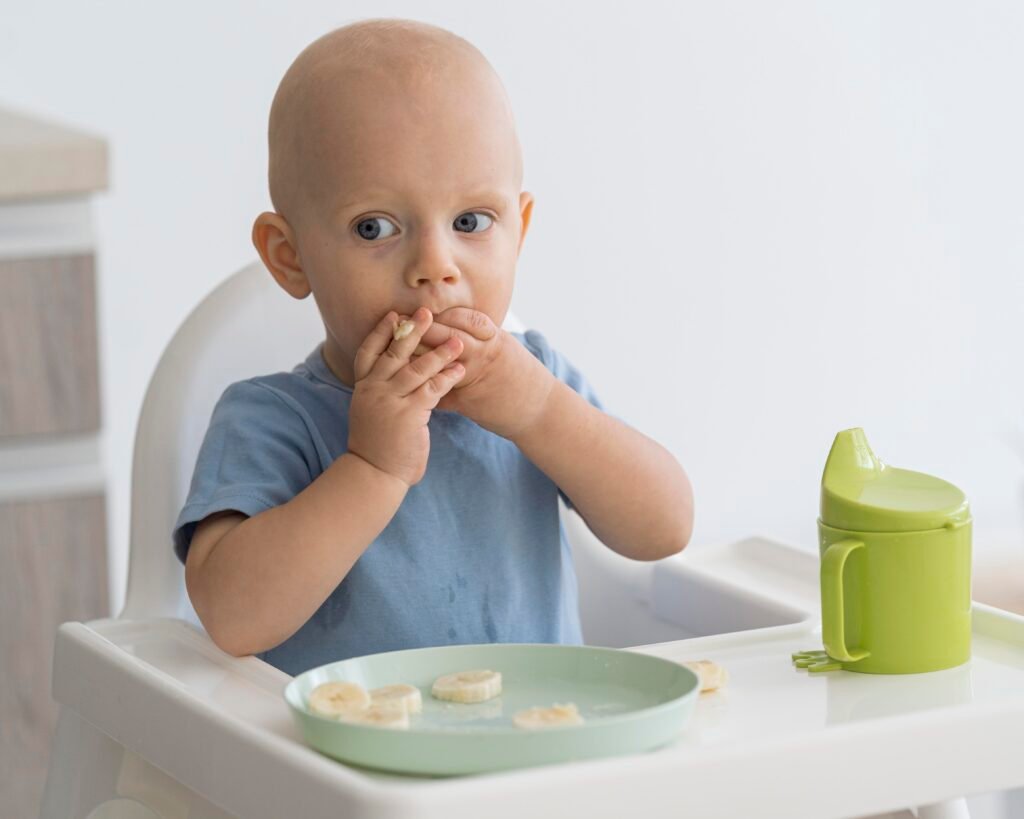 adorable-baby-playing-with-food