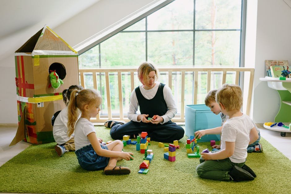 pexels photo 8535183 8535183 Children enjoying playtime with blocks and cardboard house in a cozy classroom.